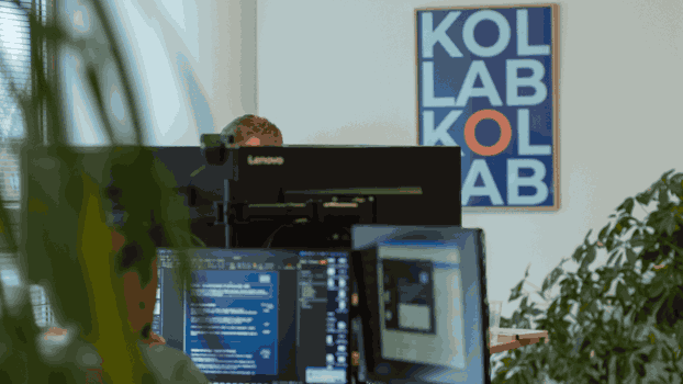 An office setting of KOLLAB picturing screens which feature data-driven recruitment flow via the integration of Teamtailor and the Master People Platform.